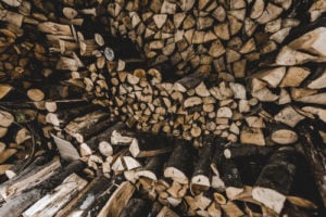 seasoned and dried firewood stacked in piles