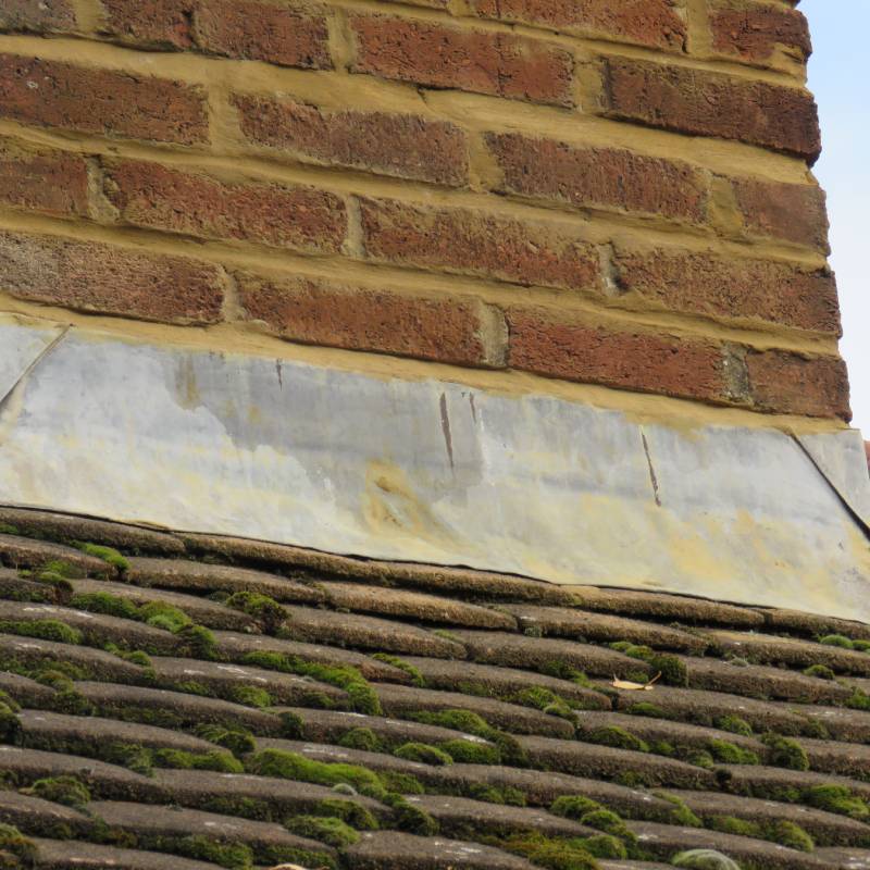 mossy-roof-tiles-chimney-lead-flashing