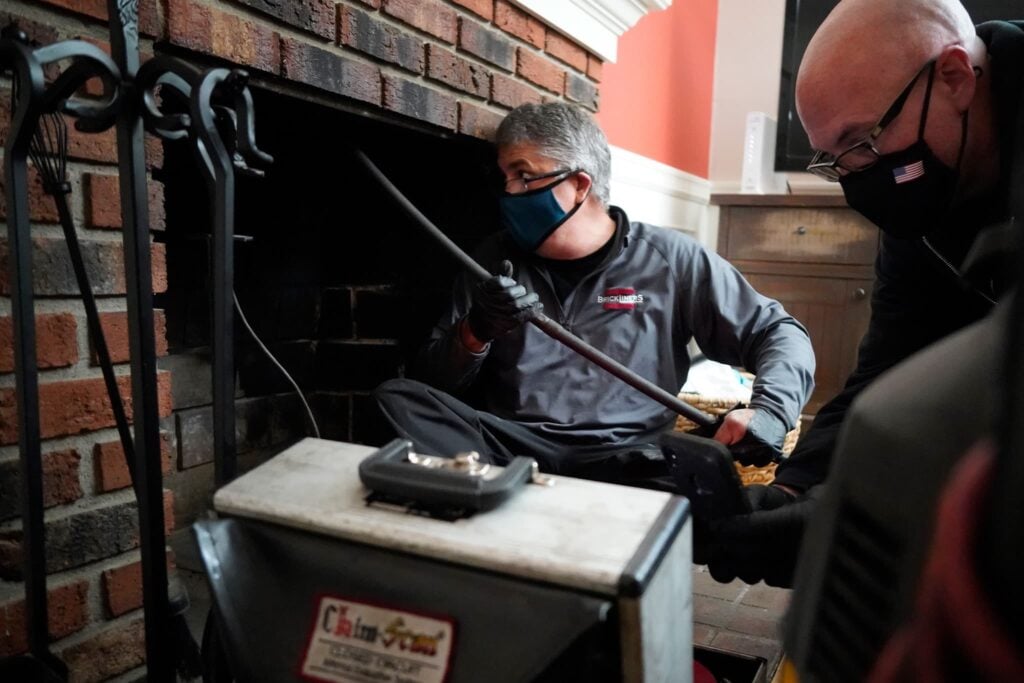 Brickliner technician performing chimney inspection